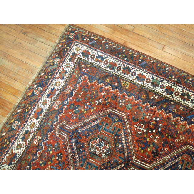 An early 20th Century hand-woven one-of-a-kind tribal Afshar rug. This piece is a true antique, one-of-a-kind rug that has...