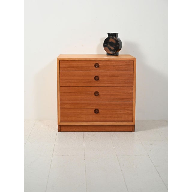 Danish 1960s chest of drawers in beech and teak, produced by Karl Andersson & Söner, with sculpted cone handles. Danish...