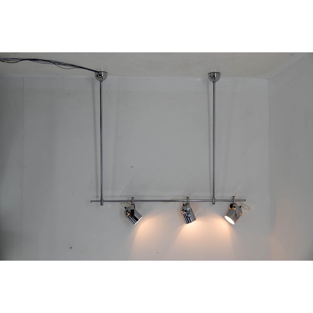 Variable ceiling light combi lux designed by stanislav indra. Three adjustable shades allow different lighting options....