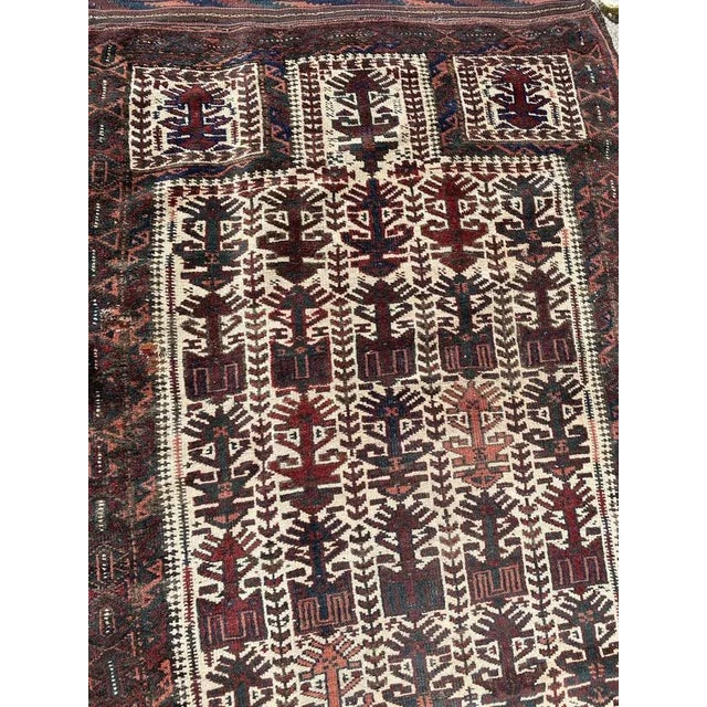 Nice mid century tribal Baluch rug with beautiful tribal design and nice natural colors, entirely and finely hand knotted...