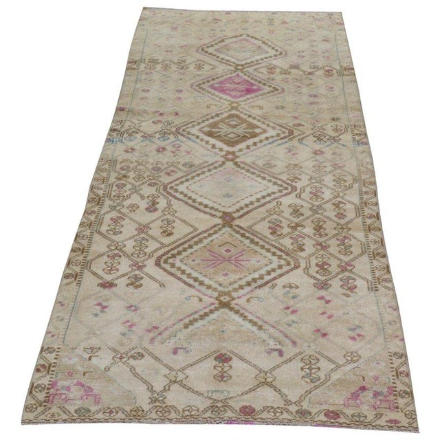 Hand-knotted with care using traditional rug-making techniques, this wool rug blends timeless craftsmanship with a modern...