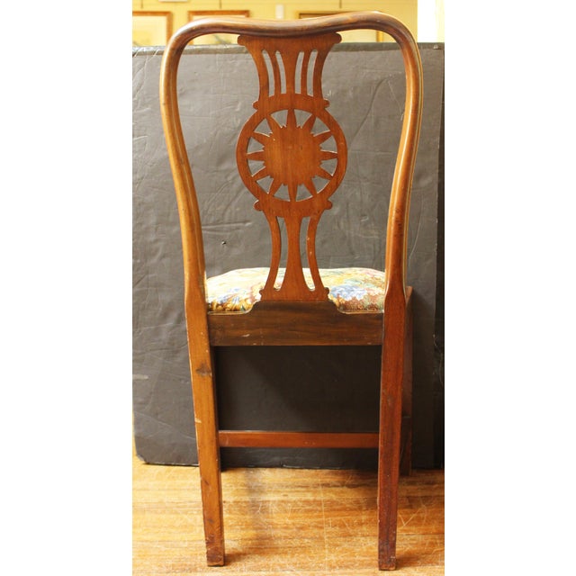 Circa 1900 Georgian Revival Style Side Chair. Mahogany with elaborately carved floral rondel backsplat. Raised on square...