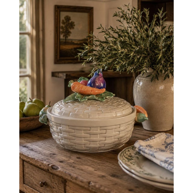 A charming circa-1980s Fitz & Floyd covered casserole dish designed as a woven white basket, complete with sculpted...