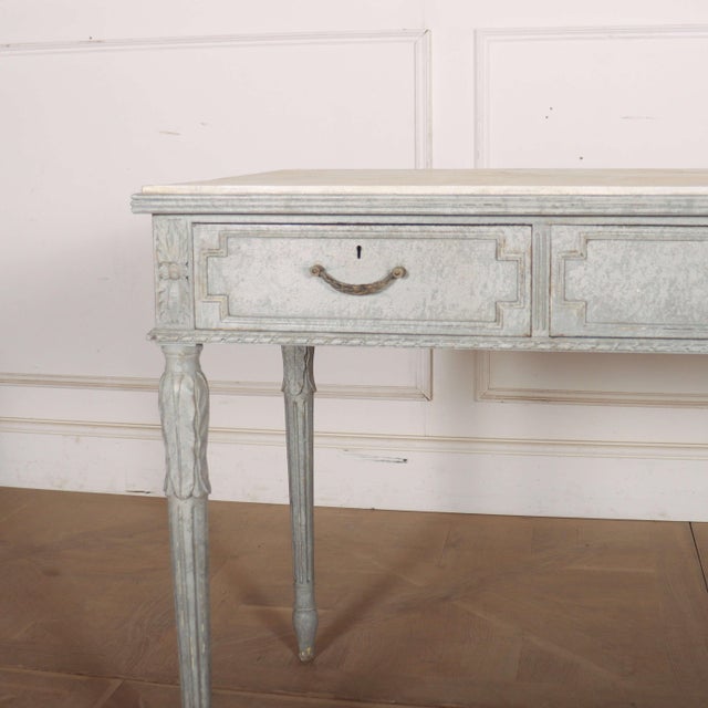 Late 19th century Swedish painted three drawer pine writing table/ desk with a faux marble top. 1890. This piece is...