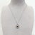 A luminous composition in platinum, this pendant centres on a vivid red spinel — a gemstone admired for its rich colour,...