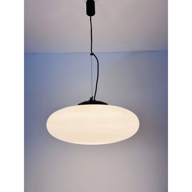 This mid-century modern ceiling lamp from the renowned Italian manufacturer Stinero, dating back to the 1950s, is a...