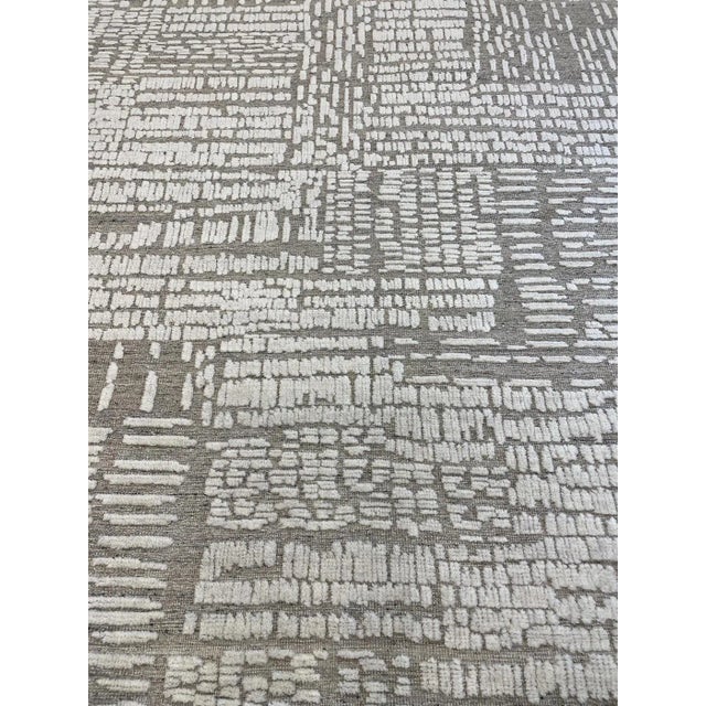 Beautiful hand knotted modern rug. Made of 75% wool and 25% cotton with very modern design and colors, this extremely...