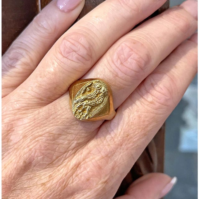 This vintage ring, crafted in 18 karat gold, brings a touch of timeless wisdom and elegance. Likely dating back to the...