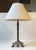 A fluted column table lamp with lion paws - everything executed in patinated brass and featuring its original bakelite...