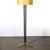 An exquisite Art Deco Machine Age cylindrical floor lamp, crafted from three Vitrolite glass rods and bronze fittings and...