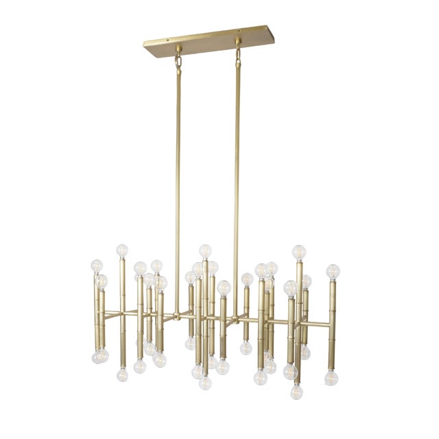 The Jonathan Adler Meurice Rectangle Chandelier is a modern reinterpretation of classic bamboo design, infusing any space...