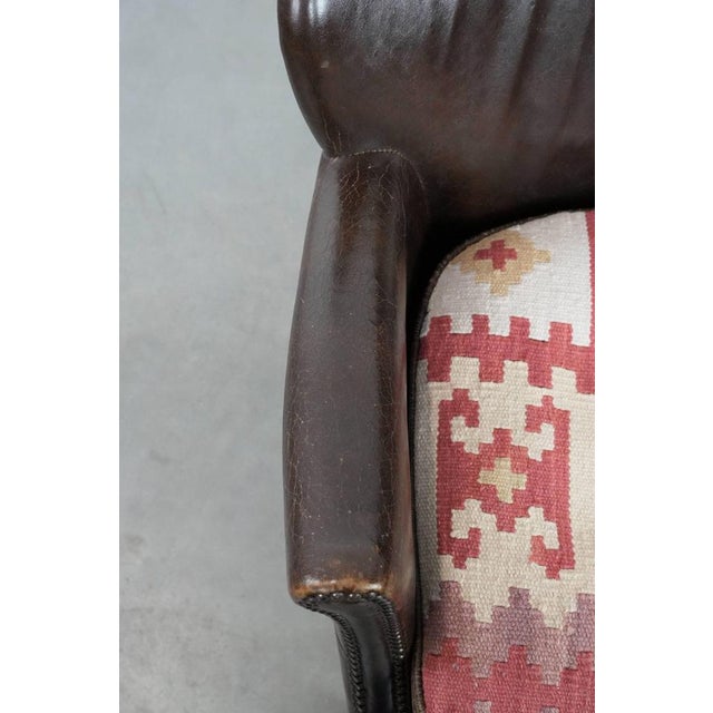 Dark Brown Armchair in Cowhide with a Reversible Kelim Seat Cushion For Sale - Image 9 of 17