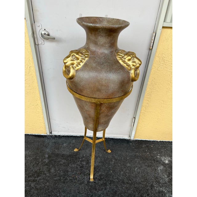 Amphora-style floor vase or decorative urn. Inspired by ancient Greco-Roman amphorae, featuring a tapered body and narrow...