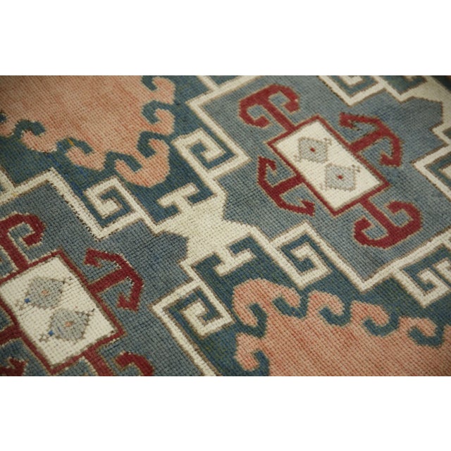 Introducing a one-of-a-kind vintage Turkish hand-knotted wool rug, carefully crafted by skilled artisans using traditional...