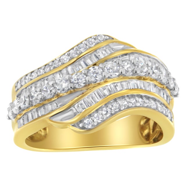 Crafted in warm 10k yellow gold, this bypassing ring features 1 cttw of diamonds. A ribbon inlaid in glimmering round cut...