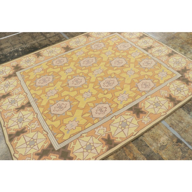 Handwoven in wool circa 1950-1960, this 8x10 vintage Kilim rug is among the most unique inspirations of Bessarabian...