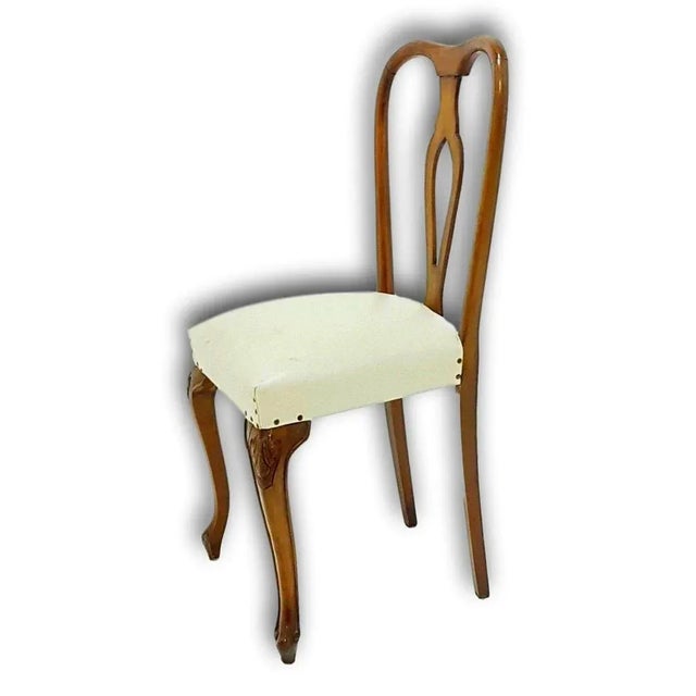 Set of four original walnut chairs of the 60s, with structure and sitting in very good conservation conditions, as shown...