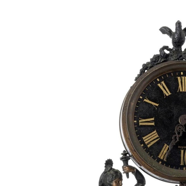 Table clock - 19th century. French, 19th/20th century; art bronze; decorated with figures. Metal and gilded dial with...