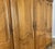 Gold Vintage Louis XVI French Oak Four Door Carved Armoire For Sale - Image 8 of 11