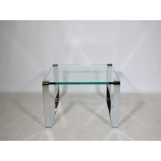 Draenert coffee table, model 1022 Classic, made of glass and chrome-plated metal, from the 1990s. A minimalist design with...