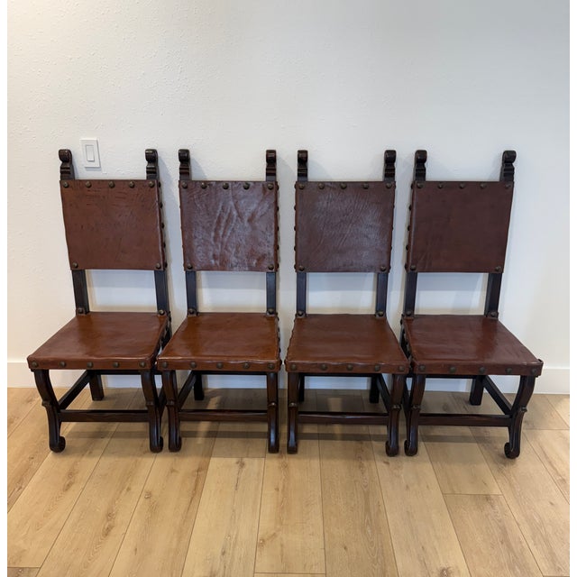 An elegant set of four authentic Spanish Colonial Revival dining chairs by South Cone Trading Co. Each chair features...
