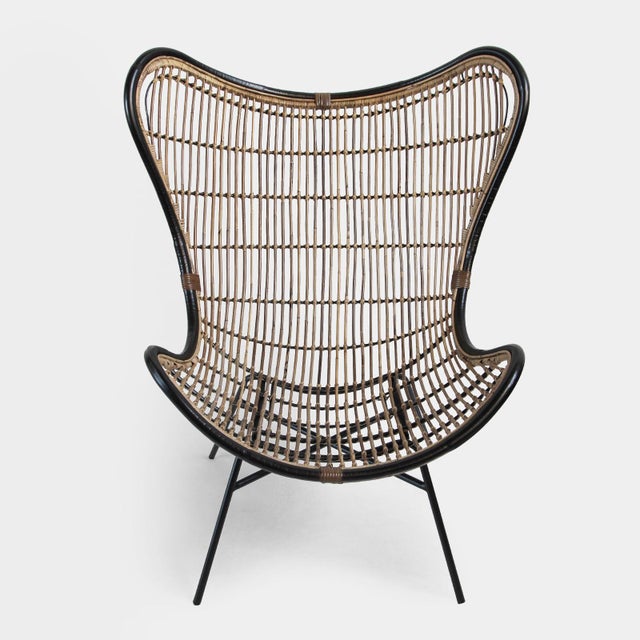 Woven bamboo and rattan scoop chair with antiqued black frame and iron legs. A unique fun chair that works indoors or...