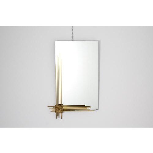 Very elegant wall mirror, Italian creation by Angelo Brotto for Esperia in the 70s. The factory adhesive label and...