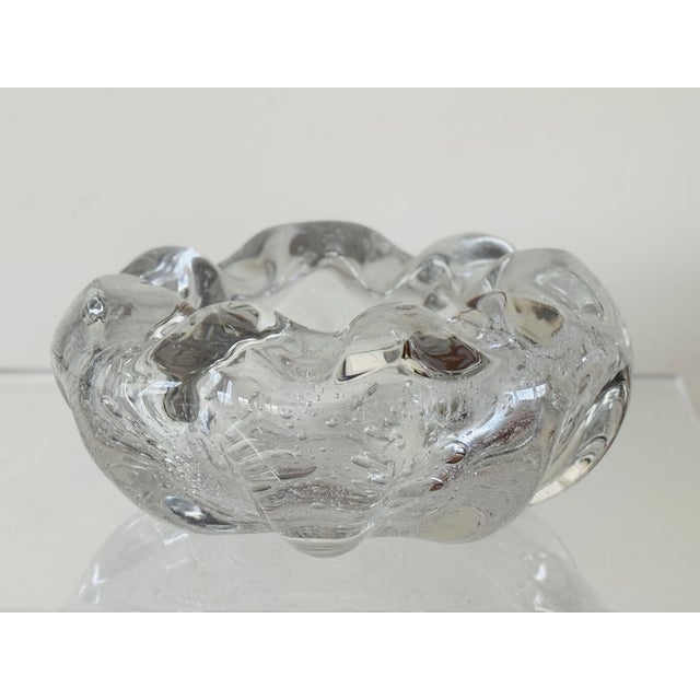 A heavy blown glass bowl in a free form lobed shape with intentional bubbles. Attributed to Ercole Barovier. From Italy...