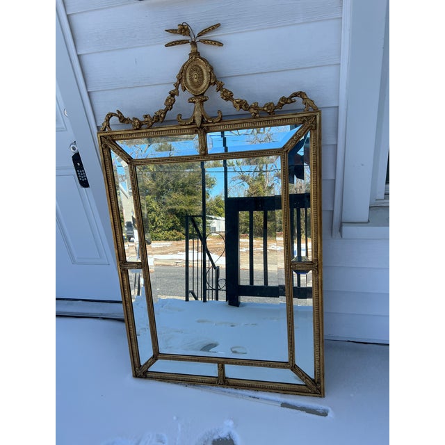 Vintage Antique French-Style Gold Beveled Mirror with Floral and Sunburst Details This unique mirror is a show-stopping...