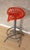 High stool with "tractor" seat style in lacquered cast iron Matt gray lacquered steel base The seat is swivel No height...