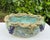 Vintage Mexican folk art ceramic bowl with an elaborate, heavily textured grapevine border. Several dimensional grape...