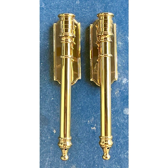 This stunning pair of vintage Regency wall sconces is a masterclass in architectural elegance and classic tailored design....