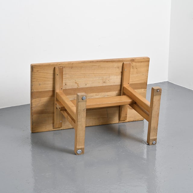 Rectangular tabletop with a solid elm stretcher base, selected for the Les Arcs ski resort. A passionate mountaineer,...
