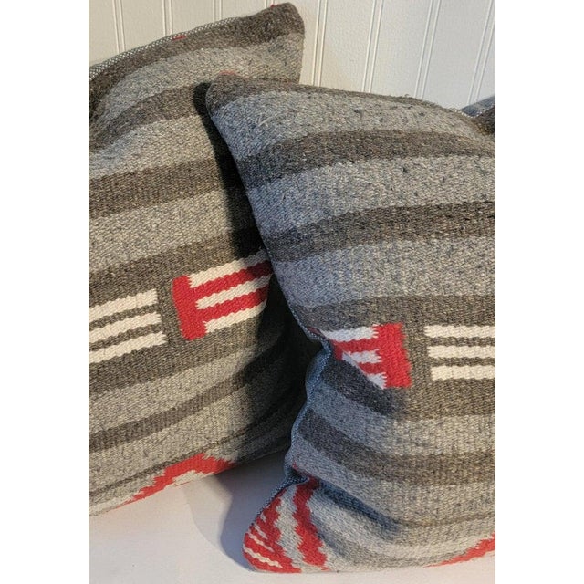 This pair of grey & red weaving pillows that looks similar to a third phase weaving.The backing is a grey cotton...