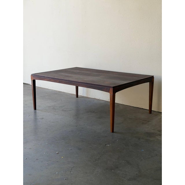 Striking large Danish Mid-Century Modern coffee table, crafted from richly figured rosewood. The expansive tabletop...