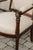 A pair of English Empire Revival upholstered armchairs from the 19th century. Each of this pair of English Empire...