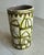 With hints of chartreuse and deep olive green, this handmade ceramic canister vase is a mid-century modern beauty. The...