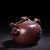 This exquisite vintage teapot is a fine example of Yixing Zisha (purple clay) craftsmanship. Handmade from Zisha clay, it...