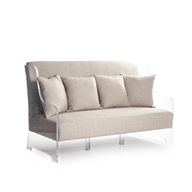 The Acrylic Bench from Zentique is a generous modern bench-settee with natural linen upholstery on a reclaimed oak and...