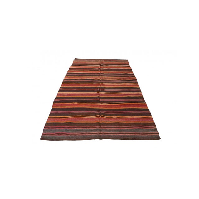 Handwoven vintage striped decorative kilim rug from Denizli region of Turkey. Approximately 50-60 years old. In very good...