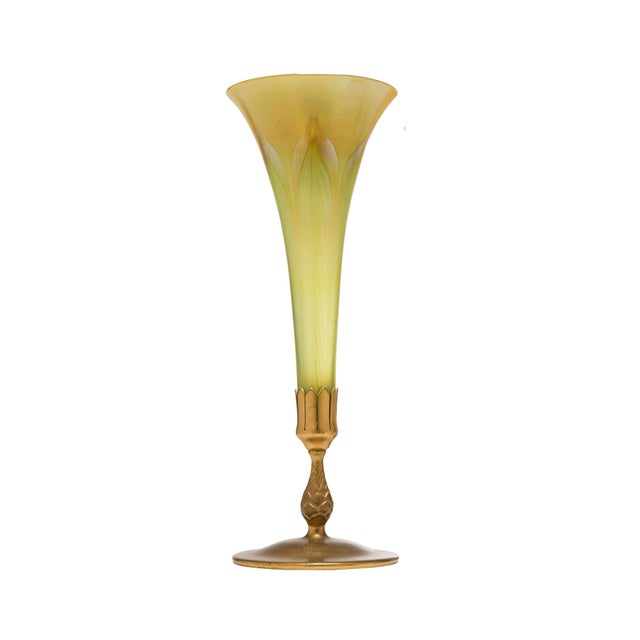 A distinguished early 20th century American vase by Tiffany Studios, circa 1920, featuring a slender trumpet-form hand-...