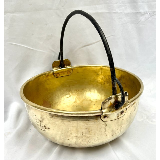 Imported from the Burgundy region of France. Handcrafted turned edge brass cauldron. Originally created for cooking. The...