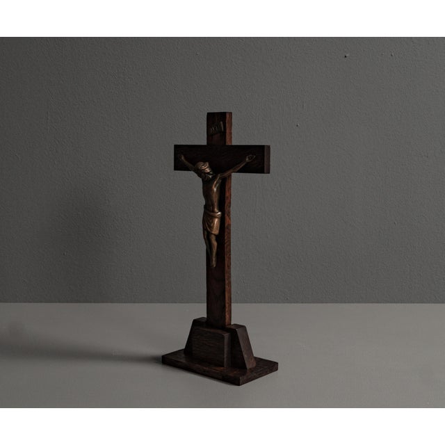 Brutalist simple wooden cross from the 20s to 50s. The base is made up of geometric elements, the cross is simply stuck in...