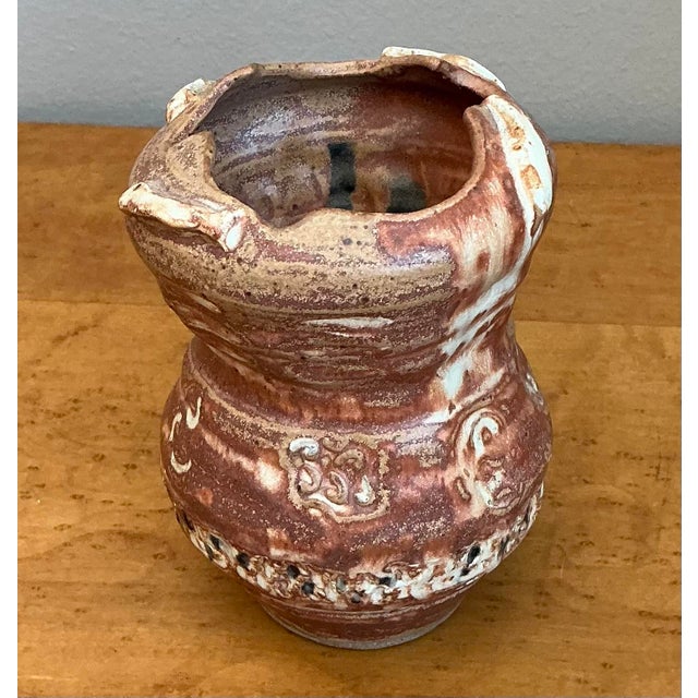 This striking abstract studio pottery vase is a masterclass in the Brutalist ceramic tradition, celebrating raw texture...