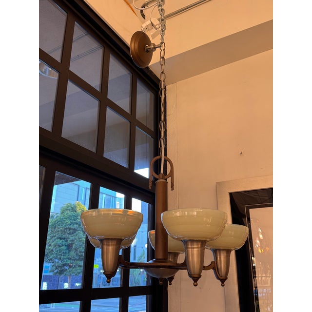 Design Plus Gallery presents a Chandelier from Rejuvenation Hardware. The chandelier combines classic form with thoughtful...