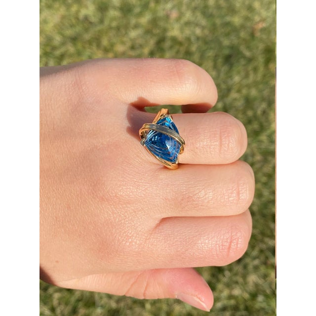 The Adonia Ladies Contemporary 14K Gold Ring set with Custom Cut Topaz. This modern cocktail ring features a custom cut...