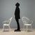 Set of four garden chairs from the 1950s-60s, crafted in white lacquered iron. These chairs feature an elegant design with...