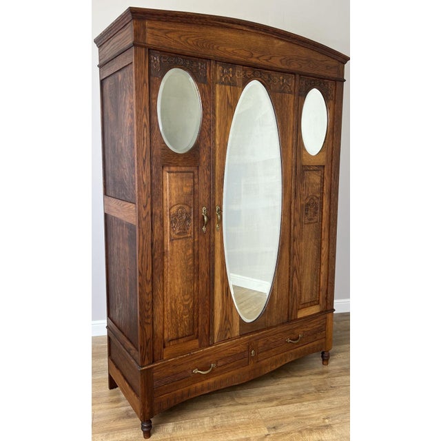 This elegant Antique French wardrobe combines practical storage with timeless period charm, featuring a warm oak finish,...