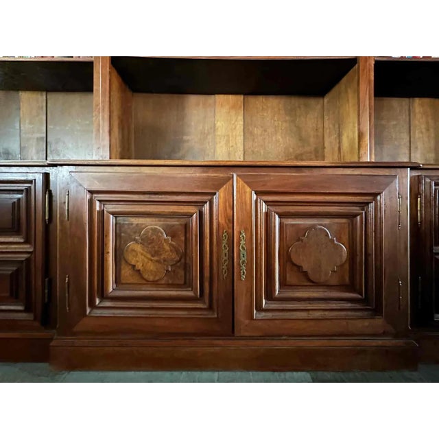 Vintage mid 20th century, three-section bookcase in beautiful French walnut. This impressive bookcase features lower...