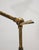 Floor lamp made in Italy in the 1950s. It features a distinctive conical-shaped adjustable diffuser in cream/light yellow...